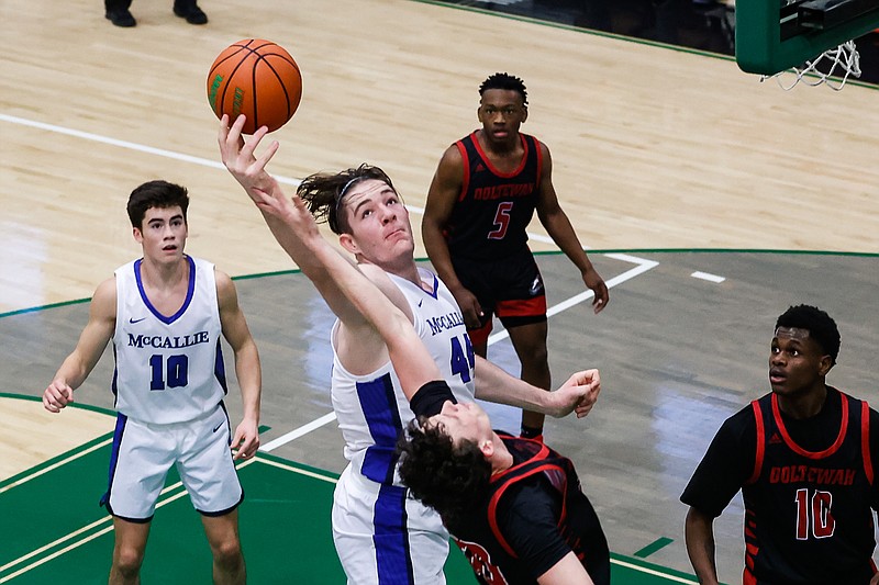 Staff photo by Troy Stolt / McCallie's David Craig (44) fights for a rebound with Ooltewah's Chris Styles (30) during the Best of Preps boys basketball tournament game between McCallie and Ooltewah at East Hamilton high school on Monday, Dec. 27, 2021 in Ooltewah, Tenn.