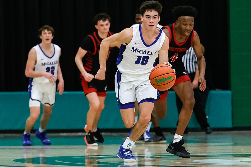 Staff photo by Troy Stolt / McCallie's Parker Robinson (10) takes off on a fast break during the Best of Preps boys basketball tournament game between McCallie and Ooltewah at East Hamilton high school on Monday, Dec. 27, 2021 in Ooltewah, Tenn.