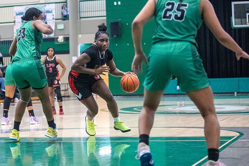 Staff photo by Troy Stolt / LFO's Christina Collins (24) drives to the basket during the girls Best of Preps tournament semi final game between East Hamilton and Lakeview Fort Oglethorpe high schools at East Hamilton High School on Tuesday, Dec. 28, 2021.