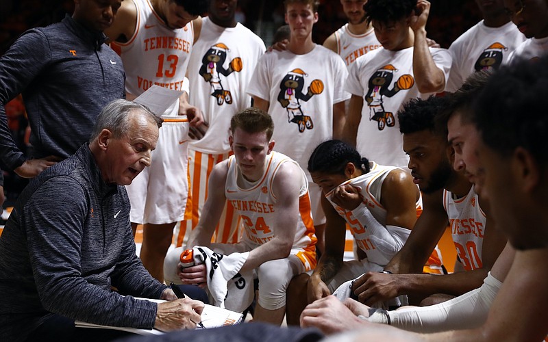 Tennessee Athletics photo / Tennessee basketball coach Rick Barnes goes over a play with his team during last Wednesday's 77-73 victory over Arizona inside Thompson-Boling Arena.