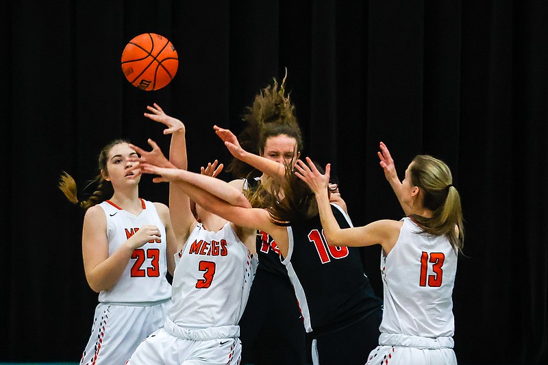 Staff photo by Troy Stolt / Meigs County's Julia Howard (3) and Signal Mountain's Jamie Kennedy (10) compete for a rebound during the girls Best of Preps tournament semi final game between Signal Mountain and Meigs County at East Hamilton high school on Tuesday, Dec. 28, 2021 in Ooltewah, Tenn.