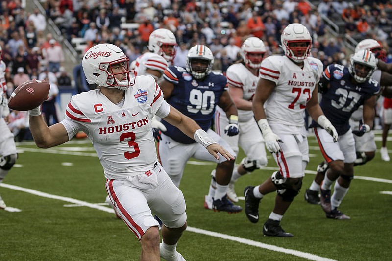 Houston quarterback Clayton Tune (3) throws a pass against Auburn during the second half of the Birmingham Bowl NCAA college football game Tuesday, Dec. 28, 2021, in Birmingham, Ala. (AP Photo/Butch Dill)