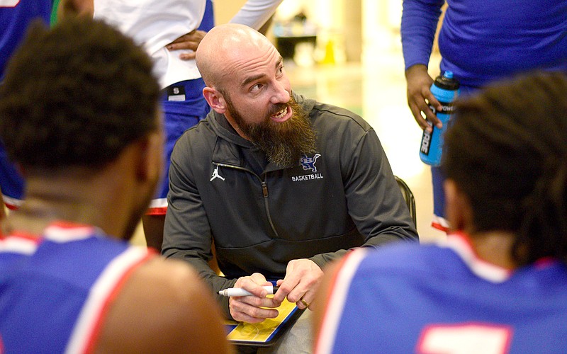 Staff Photo by Robin Rudd /  Red Bank head coach Nick Fike directs the Lions.  The Ooltewah Owls faced the Red Bank Lions in a boys consolation game of the Best Of Preps Basketball Tournament at East Hamilton High School on December 29, 2021.  