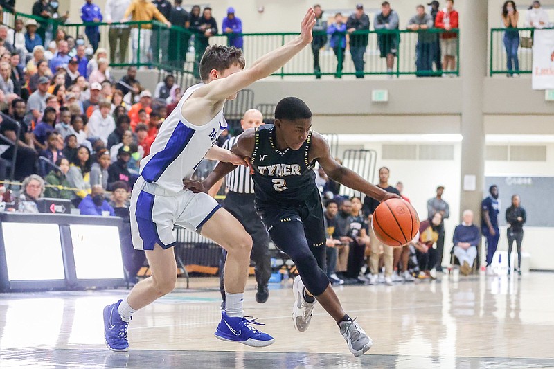 Staff photo by Troy Stolt / Tyner's Rodney Henderson (2) drives to the basket during the championship game of the Best of Preps tournament between McCallie and Tyner high schools at East Hamilton high school on Wednesday, Dec. 29, 2021 in Ooltewah, Tenn.