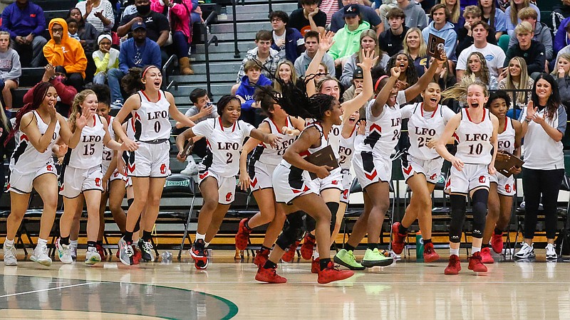 Staff photo by Troy Stolt / The LFO girls basketball team celebrates after winning the championship game of the Best of Preps tournament between Lakeview-Fort Oglethorpe and Meigs County high schools at East Hamilton high school on Wednesday, Dec. 29, 2021 in Ooltewah, Tenn.