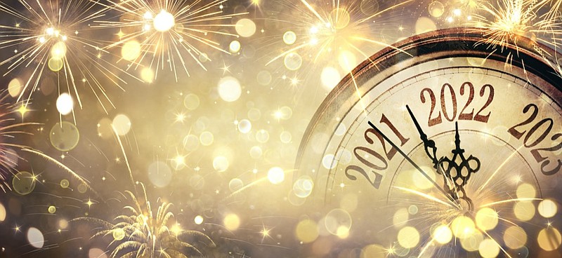 2022 New Year - Clock And Fireworks - Countdown To Midnight - Abstract Defocused Background - stock photo new year tile / Getty Images
