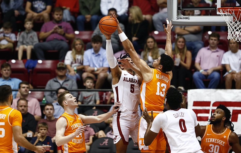 Tennessee Athletics photo / Tennessee's Olivier Nkamhoua challenges Alabama's Jaden Shackelford during Wednesday night's game in Tuscaloosa, which marked the Southeastern Conference opener for both teams.