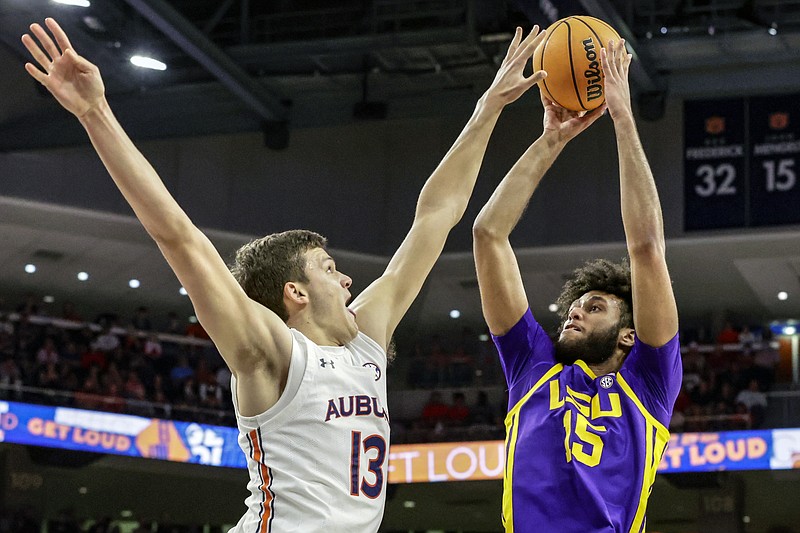 Auburn forward Walker Kessler (13) blocks the shot of LSU center Efton Reid (15) during the first half of an NCAA college basketball game Wednesday, Dec. 29, 2021, in Auburn, Ala. (AP Photo/Butch Dill)