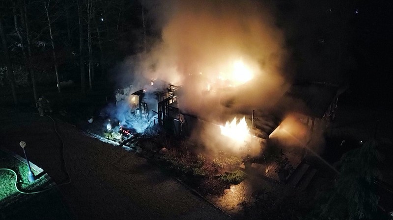 Photo contributed by Hamilton County Emergency Management and Homeland Security Agency / A fire burns at a Maple Lane home in the Birchwood area early Thursday morning. The building was destroyed.