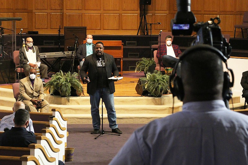 Staff photo by Wyatt Massey / Bishop Kevin Adams, pastor of Olivet Baptist Church, speaks during a prayer service at his church on June 1. The church will host a Watch Night service on New Year's Eve.