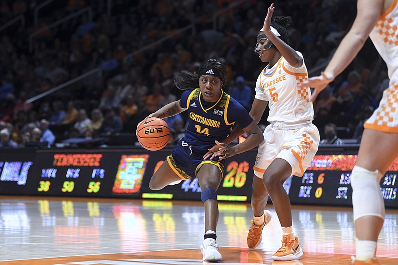 Knoxville News Sentinel photo by Saul Young via AP / UTC's Amaria Pugh drives toward the basket while guarded by Tennessee's Kaiya Wynn during Monday night's game in Knoxville. Pugh had 17 points as UTC's only scorer in double figures in a 91-41 loss to the seventh-ranked Lady Vols.