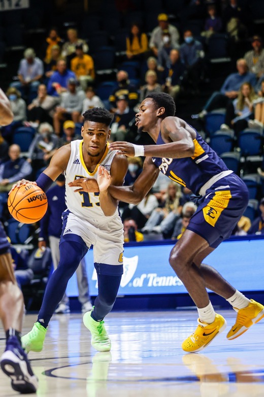 Staff photo by Troy Stolt / UTC Mocs guard Malachi Smith (13) drives to the basket during the basketball game between UTC and East Tennessee State at Mckenzie Arena on Thursday, Dec. 30, 2021 in Chattanooga, Tenn.