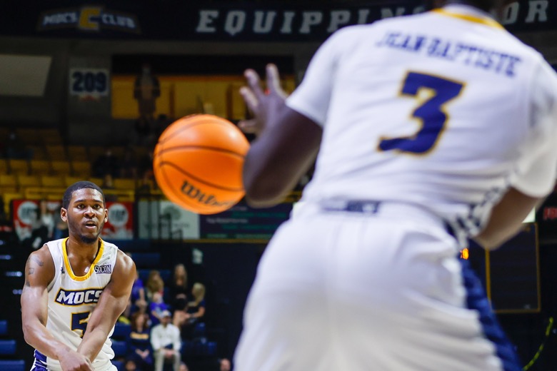 Staff photo by Troy Stolt / UTC Mocs forward Darius Banks (5) passes the ball to UTC Mocs guard David Jean-Baptiste (3) during the basketball game between UTC and East Tennessee State at Mckenzie Arena on Thursday, Dec. 30, 2021 in Chattanooga, Tenn.