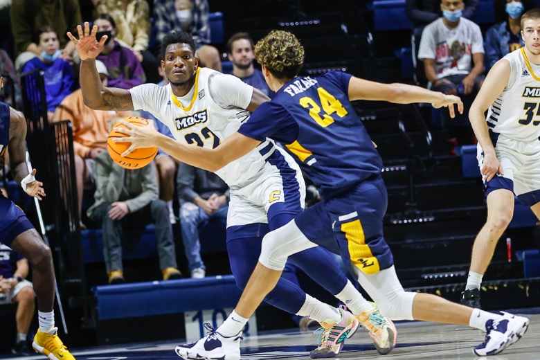 Staff photo by Troy Stolt / UTC Mocs forward Silvio De Sousa (22) guards East Tennessee State Buccaneers forward Isaac Farah (24) during the basketball game between UTC and East Tennessee State at Mckenzie Arena on Thursday, Dec. 30, 2021 in Chattanooga, Tenn.