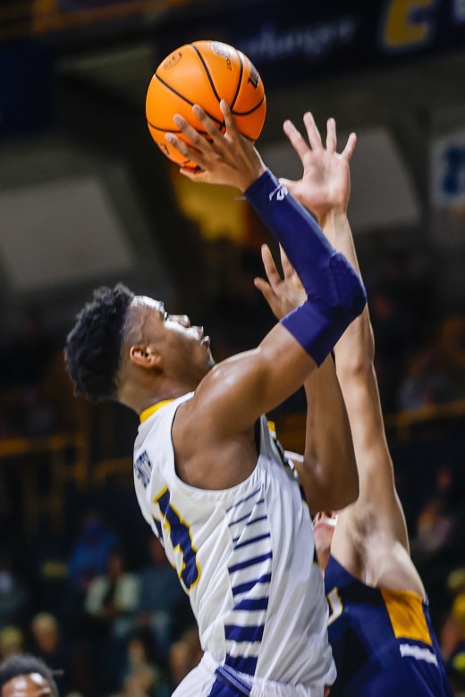 Staff photo by Troy Stolt / UTC Mocs guard Malachi Smith (13) goes for a lay up during the basketball game between UTC and East Tennessee State at Mckenzie Arena on Thursday, Dec. 30, 2021 in Chattanooga, Tenn.