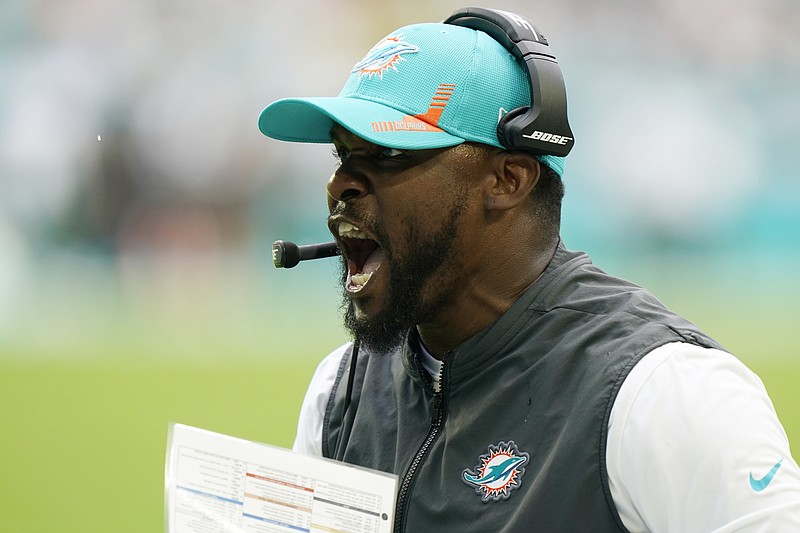 AP file photo by Wilfredo Lee / Miami Dolphins coach Brian Flores is trying to lead the team to its first playoff berth since 2016, three years before he was hired.