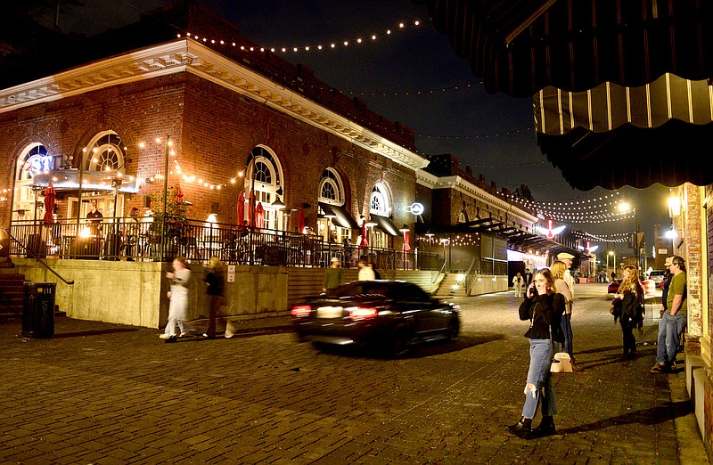 Staff Photo by Robin Rudd / Station Street and the Choo Choo come alive early in the evening on Dec. 31, 2021. 