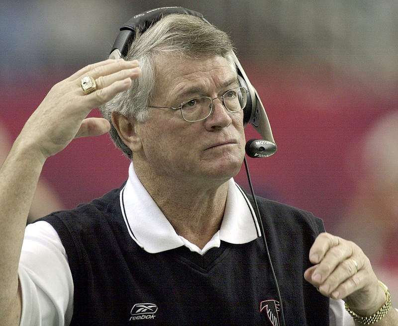 AP photo by Ric Feld /Atlanta Falcons coach Dan Reeves adjusts his headset at the start of a game against the Detroit Lions at the Georgia Dome on Dec. 22, 2002.