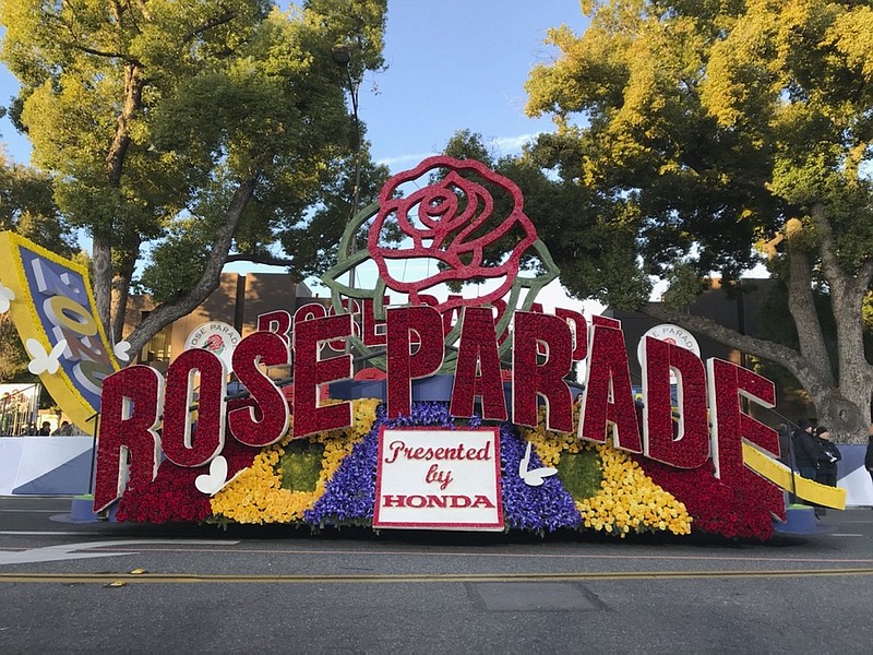 FILE - In this Jan. 1, 2020, file photo, a 2020 Rose Parade float is seen at the start of the route at the 131st Rose Parade in Pasadena, Calif. The Rose Parade and Rose Bowl college football game between Ohio State and Utah were set to go forward on New Year's Day despite surging cases of COVID-19, which forced the cancelation of the 2021 parade. (AP Photo/Michael Owen Baker, File)

