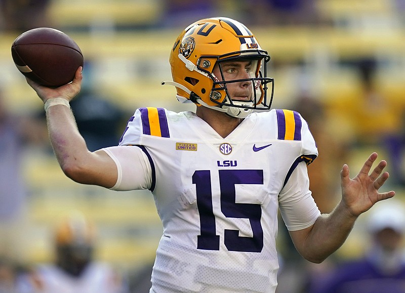 FILE - LSU quarterback Myles Brennan passes in the second half an NCAA college football game against Mississippi State in Baton Rouge, La., Sept. 26, 2020. Brennan has decided to exit the transfer portal and return to LSU under new head coach Brian Kelly. (AP Photo/Gerald Herbert, File)