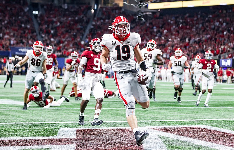 Georgia photo by Tony Walsh / Georgia freshman tight end Brock Bowers hauls in an 18-yard touchdown reception during last month's loss to Alabama in the Southeastern Conference title game. Bowers has six scoring catches in his last four games.