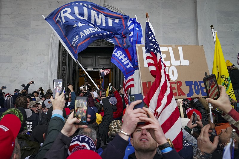 AP File Photo/John Minchillo / Protesters loyal to President Donald Trump riot outside the Capitol, Jan. 6, 2021, in Washington, D.C.