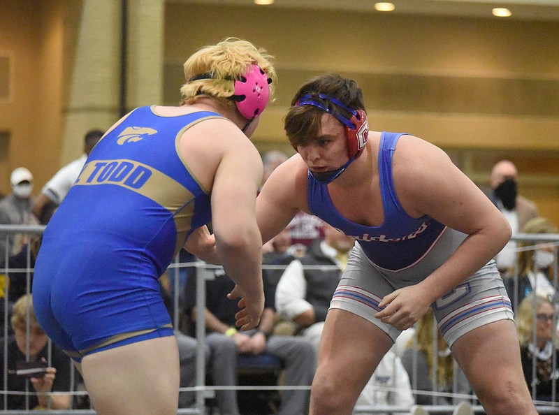 Staff photo by Matt Hamilton / Cleveland's Ashton Davis, right, wrestles Wilson Central's Noah Todd in the 220-pound championship match at the TSSAA Class AAA state traditional tournament last Feb. 26 at the Chattanooga Convention Center.