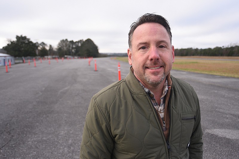 Staff Photo by Matt Hamilton / Owner Chad Roberts stands on the tarmac of what was the Cleveland Airport at Solutions Oriented Services in Cleveland, Tenn., on Tuesday, January 4, 2022.