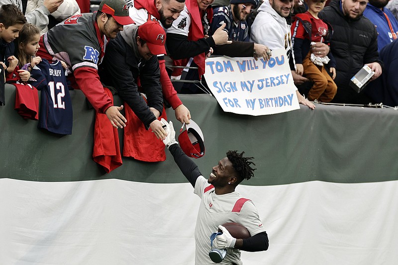 AP photo by Adam Hunger / Tampa Bay Buccaneers receiver Antonio Brown greets fans before Sunday's game against the New York Jets in East Rutherford, N.J.