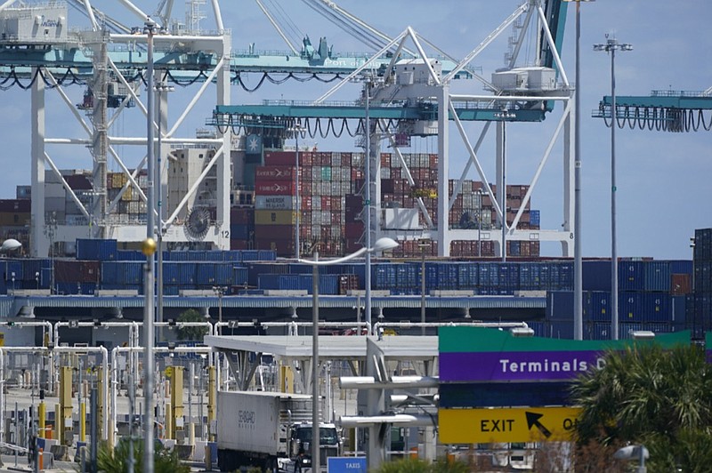 In this April 9, 2021 photo, cargo containers are shown stacked near cranes at PortMiami in Miami. (AP Photo/Wilfredo Lee, file)


