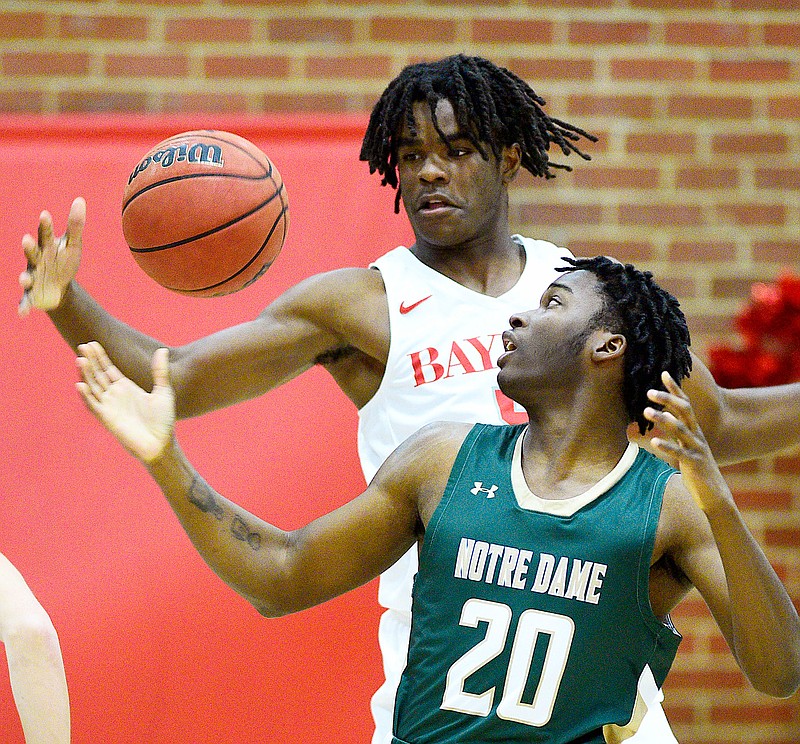 Staff photo by Robin Rudd / Notre Dame's Ty Wilkerson and Baylor's Cam Sparks go after a loose ball during Friday night's game at Baylor School. The host Red Raiders won 42-28 to improve to 12-4.