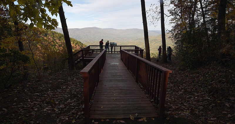 Staff file photo by Matt Hamilton / Visitors can be seen enjoying the view of the Chattahoochee National Forest and Cohutta Wilderness at the Cool Creek overlook in Fort Mountain State Park on Saturday, Nov., 6, 2021.