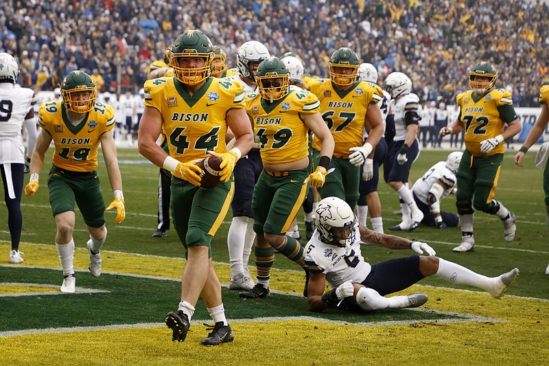 AP photo by Michael Ainsworth / North Dakota State fullback Hunter Luepke (44) celebrates after scoring a touchdown against Montana State in the FCS title game Saturday in Frisco, Texas.