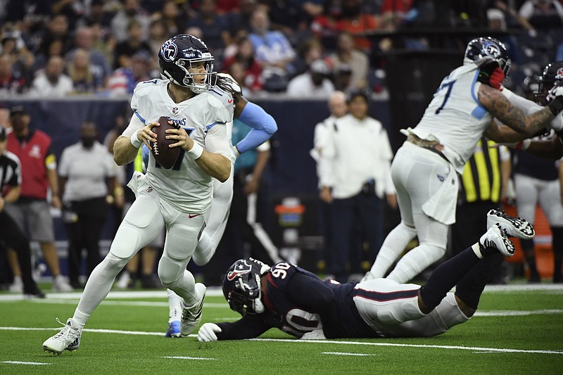 AP photo by Justin Rex / Tennessee Titans quarterback Ryan Tannehill looks for a receiver during the first half of Sunday's game against the Houston Texans. Tannehill threw four touchdown passes, three of them in the second quarter, to lead the Titans to a 28-25 win in Houston.