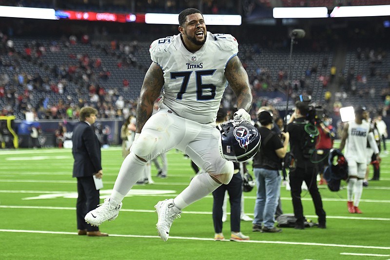 AP photo by Justin Rex / Tennessee Titans offensive guard Rodger Saffold celebrates with fans after Sunday's road win against the Houston Texans to close the regular season and lock up the AFC's No. 1 seed for the NFL playoffs.