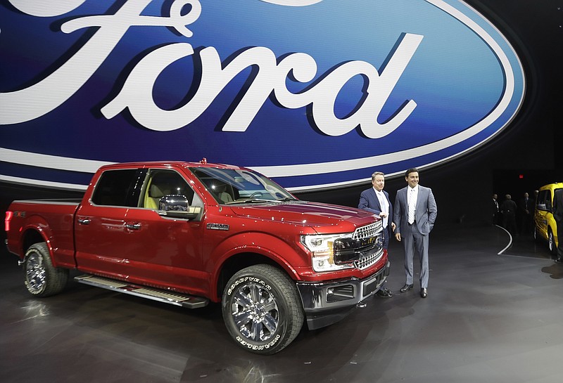 Ford Motor Co. Executive Chairman Bill Ford, left, and Chief Executive Mark Fields stand next to a Ford F-150 truck at the North American International Auto show in 2017, in Detroit. The Ford 150 truck was the top-selling new and used vehicle in Hamilton County last year. (AP Photo/Carlos Osorio)