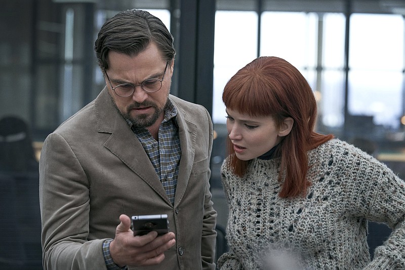 Photo by Niko Tavernise/Netflix via The Associated Press / This image released by Netflix shows Leonardo DiCaprio, left, and Jennifer Lawrence in "Don't Look Up."