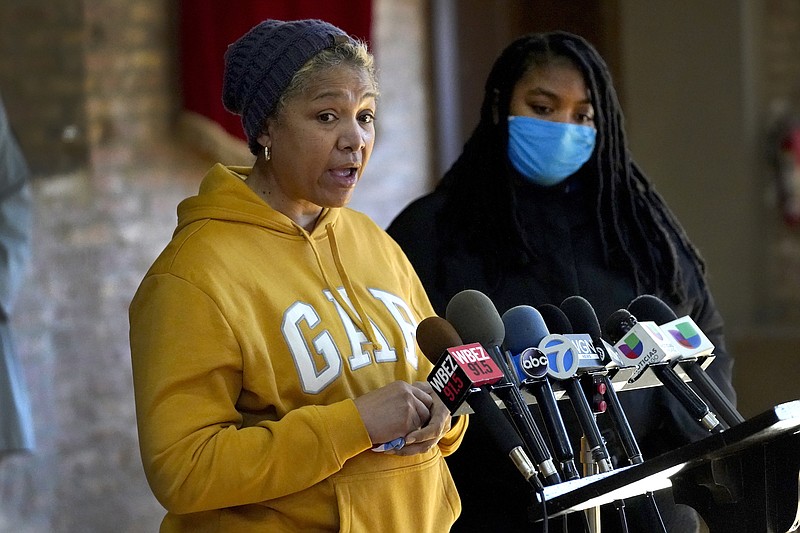 Photo by Charles Rex Arbogast of The Associated Press / Cheri Warner, left, stands with her daughter, Brea, and speaks calling for the Chicago school district and teacher's union to focus on getting students back in the classroom on Monday, Jan. 10, 2022, in Chicago. Hundreds of thousands of Chicago students remained out of school for a fourth day Monday, after leaders of the nation's third-largest school district failed to resolve a deepening clash with the influential teachers union over COVID-19 safety protocols.