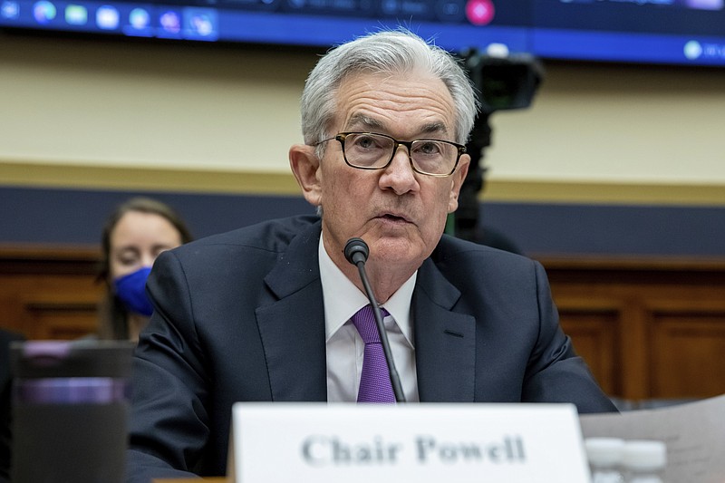 FILE - Federal Reserve Chairman Jerome Powell speaks to lawmakers during a House Committee on Financial Services hearing on Capitol Hill in Washington, Dec. 1, 2021. With inflation surging, unemployment falling and wages rising, some economists are warning that the Federal Reserve may have waited too long to reverse its ultra-low-rate policies — a delay that could put the economy at heightened risk. (AP Photo/Amanda Andrade-Rhoades)