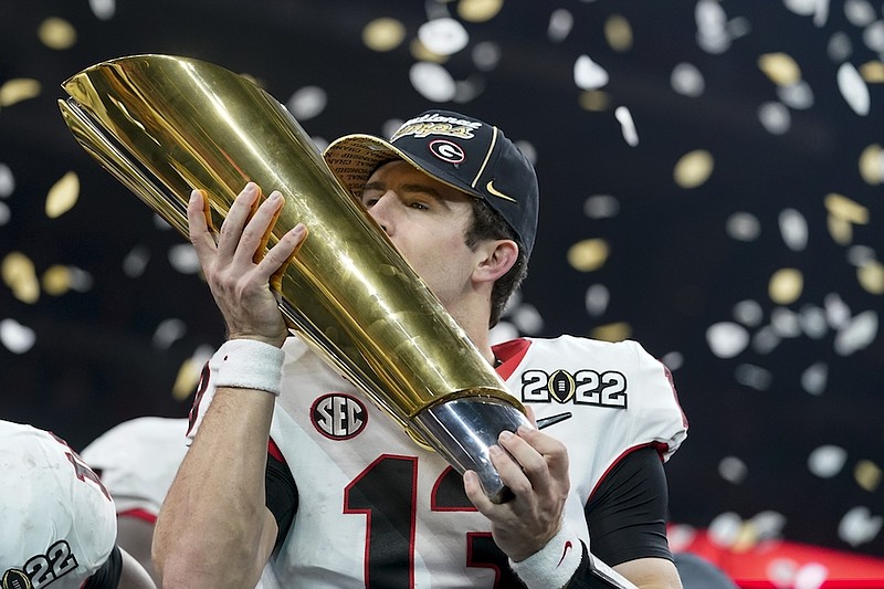 Georgia's Stetson Bennett celebrates after the College Football Playoff championship football game against Alabama Tuesday, Jan. 11, 2022, in Indianapolis. Georgia won 33-18. (AP Photo/Darron Cummings)