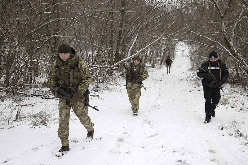 Photo by Tyler Hicks of The New York Times / Ukrainian border guards on a joint patrol on Jan. 9, 2022, near the border with Belarus. With Ukraine a NATO partner but not a member, it does not benefit from NATO's core principle, the commitment to collective defense, though Ukraine has sent troops to fight in NATO missions in both Iraq and Afghanistan.