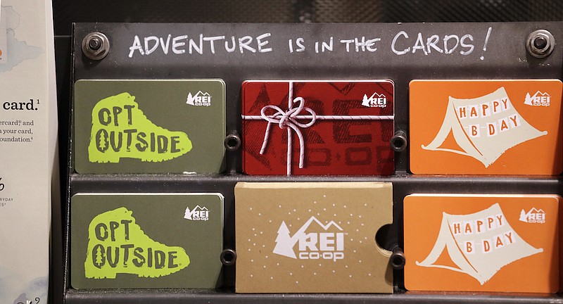 Gift cards are displayed for sale at REI's flagship store, Tuesday, Nov. 13, 2018, in Seattle. (AP Photo/Elaine Thompson)