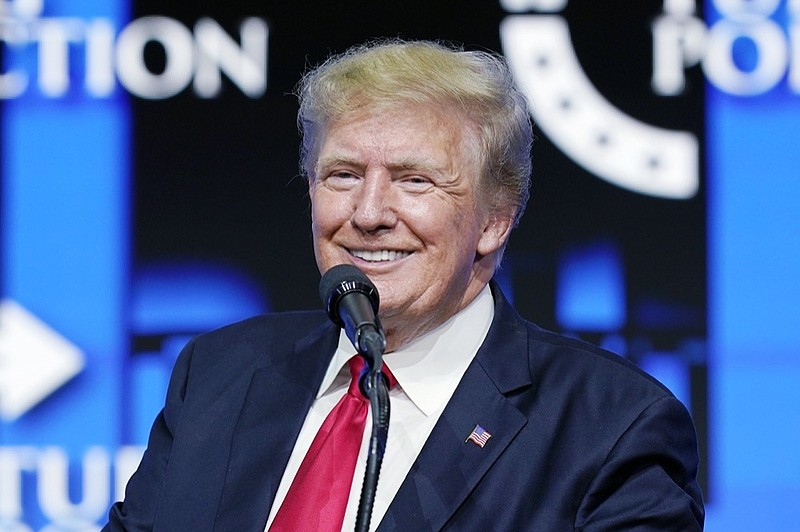 FILE - Former President Donald Trump smiles as he pauses while speaking to supporters at a Turning Point Action gathering in Phoenix, July 24, 2021. (AP Photo/Ross D. Franklin, File)


