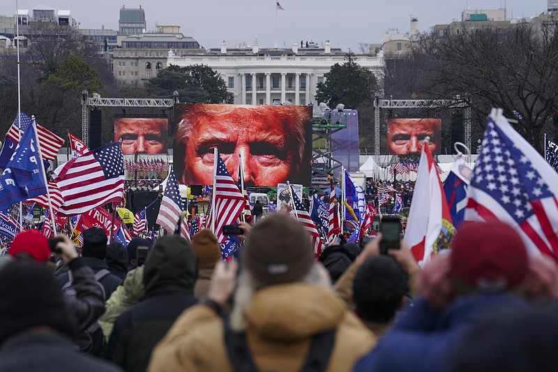 File photo by John Minchillo of The Associated Press / In this Jan. 6, 2021 file photo, Trump supporters participate in a rally in Washington. Many of those who stormed the Capitol on Jan. 6 cited falsehoods and conspiracy theories about the election.