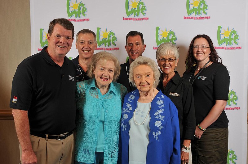 Contributed Photo by TVFCU / Actress Betty White, center front, poses with Chattanooga resident Sarah Ruth Hilliard, winner of the Tennessee Valley Federal Credit Union's look-alike contest, part of the Life expo for boomers and seniors in 2010. Others, from left, are Blake Strickland, TVFCU's then-president and CEO; Hilliard' son Alan Hilliard; and TVFCU staffers John Merritt, Lynda Henry and Sarah Beth Knott.