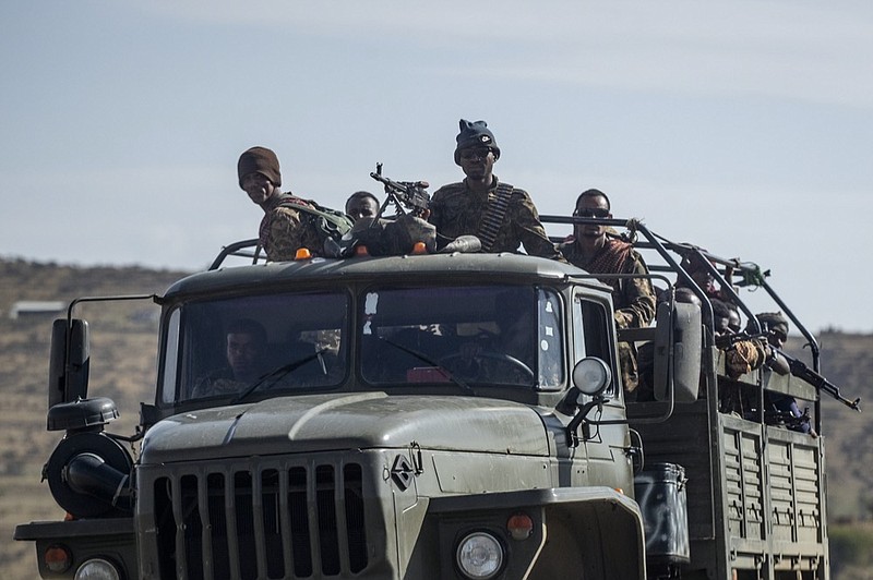 FILE - Ethiopian government soldiers ride in the back of a truck on a road near Agula, north of Mekele, in the Tigray region of northern Ethiopia, Saturday, May 8, 2021. (AP Photo/Ben Curtis, File)


