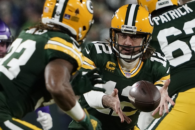 AP photo by Morry Gash / Green Bay Packers quarterback Aaron Rodgers pitches to Aaron Jones during a home game against the Minnesota Vikings on Jan. 2.