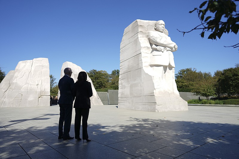 File photo by Doug Mills of The New York Times / President Joe Biden and Vice President Kamala Harris visit the Martin Luther King Jr. Memorial to celebrate the 10th anniversary of its dedication in Washington on Oct. 21, 2021.