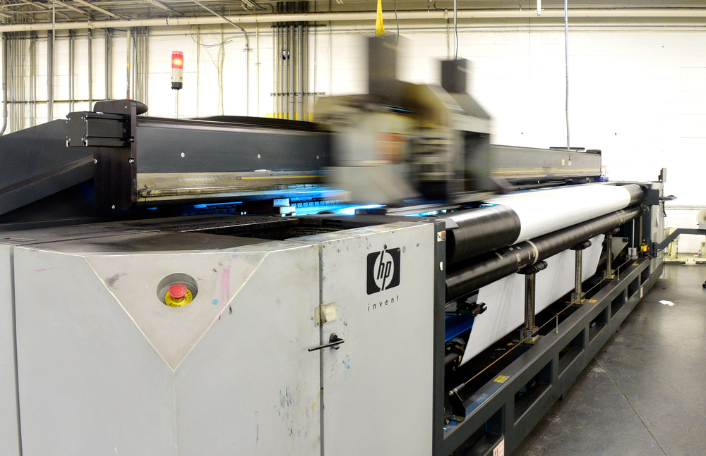 Staff Photo by Robin Rudd / A huge Hewlett Packard printer produces outdoor media. Vincent Printing, formed in 1940, and located in East Chattanooga, is one of the country's biggest print shops of its type. New owner. Beau Wells talked with the newspaper on January 13, 2022.