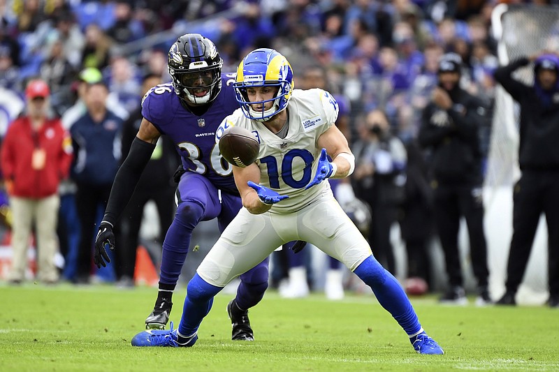 AP photo by Terrance Williams / Los Angeles Rams wide receiver Cooper Kupp waits for a pass while covered by Baltimore Ravens safety Chuck Clark on Jan. 2 in Baltimore.